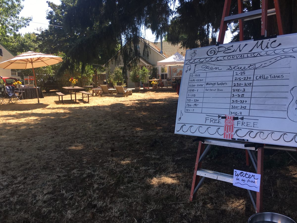 Open mic sign-up board in a neighbor's front yard.