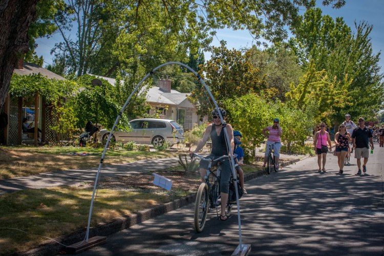 Person riding a bike travels through an arch mister