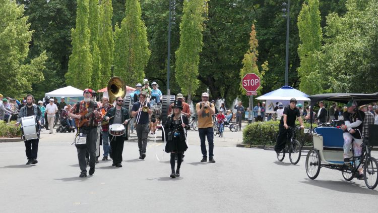 Marching band leads the parade from 1st Street