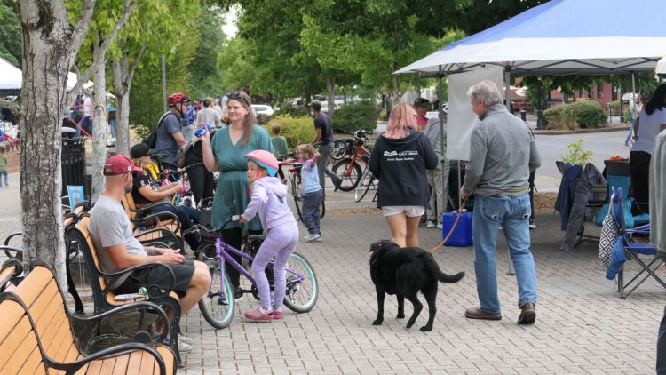 People gather on the Riverfront Plaza